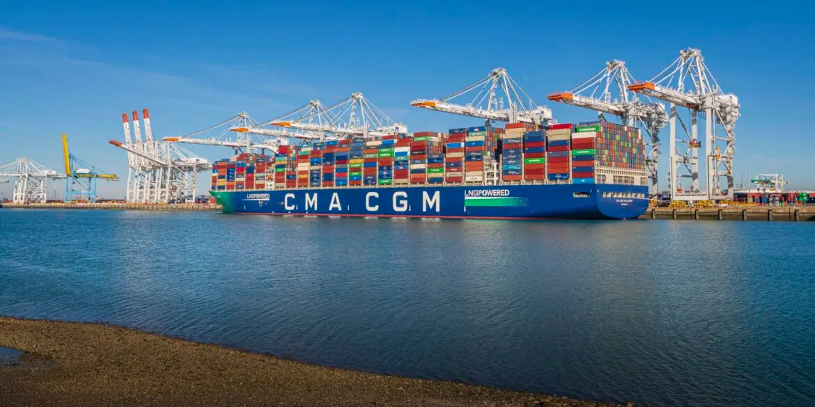 Cargo ship at port with fuel tanks, depicting urgency.