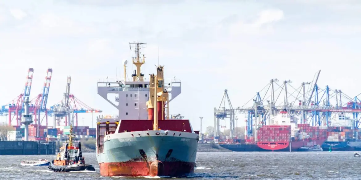 Container ship at sea, US flag, global trade routes.